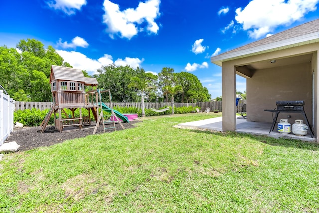 551 SW Lairo Ave, Port Saint Lucie, FL 34953 - view of yard with a fenced backyard, a playground, and a patio area