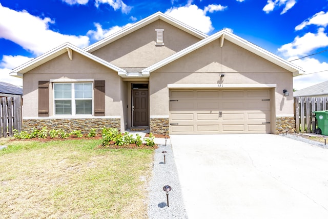 551 SW Lairo Ave, Port Saint Lucie, FL 34953 - ranch-style home with a front yard, a garage, stone siding, concrete driveway, and stucco siding