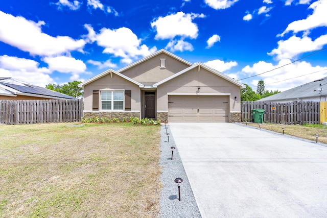 551 SW Lairo Ave, Port Saint Lucie, FL 34953 - single story home with stucco siding, a garage, stone siding, a front lawn, and concrete driveway