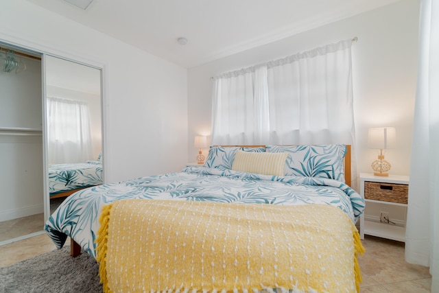 951 Green St, West Palm Beach, FL 33405 - bedroom featuring a closet, tile patterned floors, and baseboards