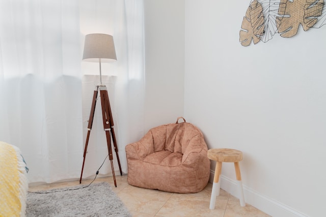 951 Green St, West Palm Beach, FL 33405 - living area featuring baseboards and tile patterned flooring