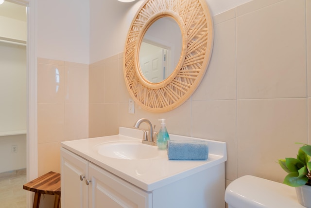 951 Green St, West Palm Beach, FL 33405 - bathroom featuring tile walls, vanity, and toilet