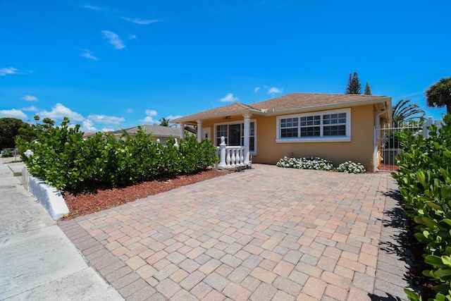951 Green St, West Palm Beach, FL 33405 - view of front facade featuring stucco siding