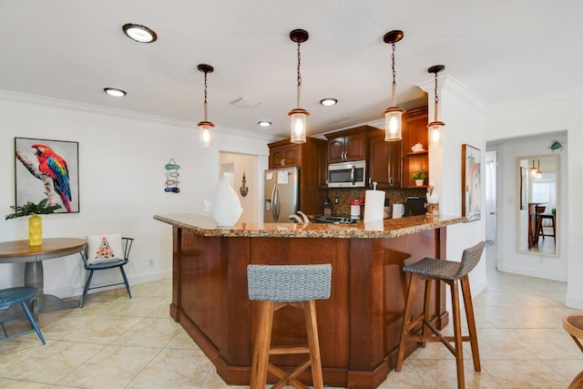 951 Green St, West Palm Beach, FL 33405 - kitchen with stainless steel appliances, crown molding, a kitchen breakfast bar, decorative backsplash, and a peninsula