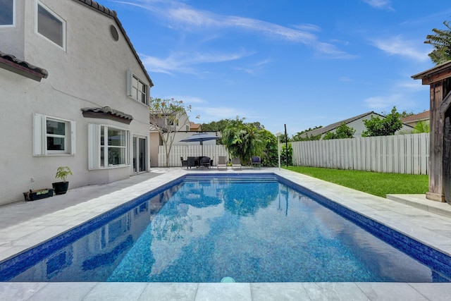 view of swimming pool with a patio, a fenced backyard, and a fenced in pool