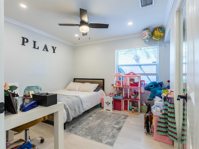 bedroom with visible vents, wood finished floors, crown molding, and recessed lighting