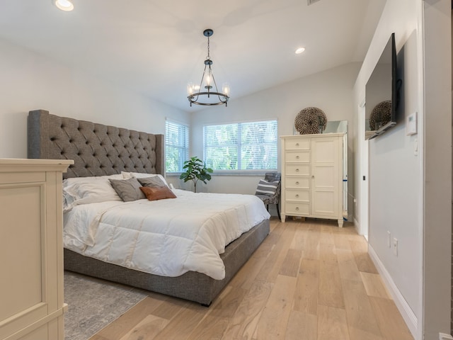 bedroom with baseboards, recessed lighting, a notable chandelier, and light wood-style flooring