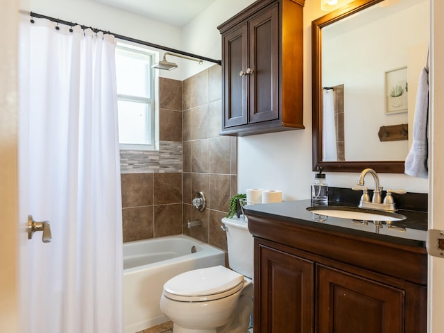 bathroom with shower / tub combo, vanity, and toilet