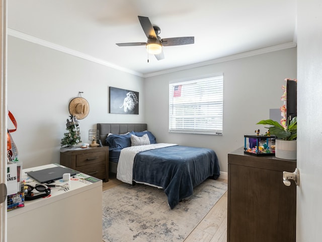 bedroom featuring light wood-style flooring, ceiling fan, and crown molding