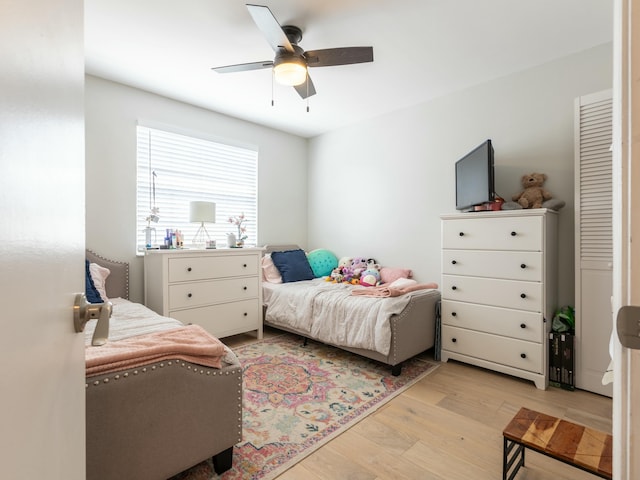 bedroom featuring a ceiling fan and light wood-type flooring