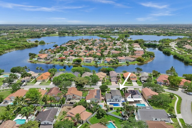 birds eye view of property featuring a residential view and a water view