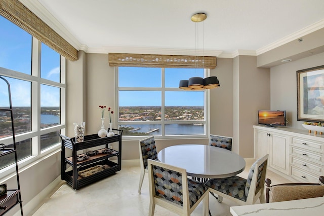 3740 S Ocean Blvd Unit 1602, Highland Beach, FL 33487 - dining area with crown molding, baseboards, and a water view
