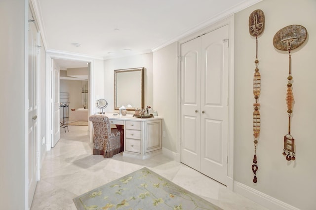 3740 S Ocean Blvd Unit 1602, Highland Beach, FL 33487 - bathroom featuring baseboards, ornamental molding, and vanity