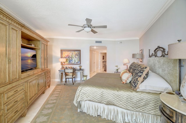 3740 S Ocean Blvd Unit 1602, Highland Beach, FL 33487 - bedroom with crown molding, arched walkways, a ceiling fan, and visible vents