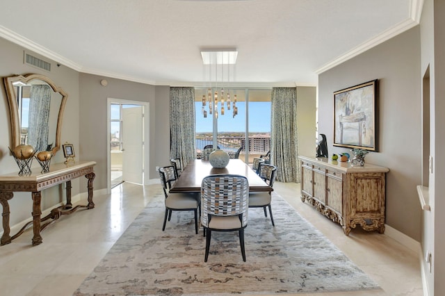 3740 S Ocean Blvd Unit 1602, Highland Beach, FL 33487 - dining space featuring crown molding, visible vents, and a wealth of natural light