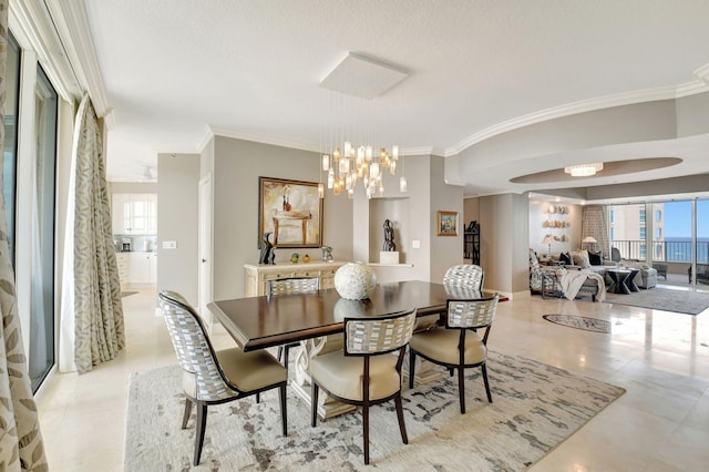 3740 S Ocean Blvd Unit 1602, Highland Beach, FL 33487 - dining area featuring crown molding and a notable chandelier
