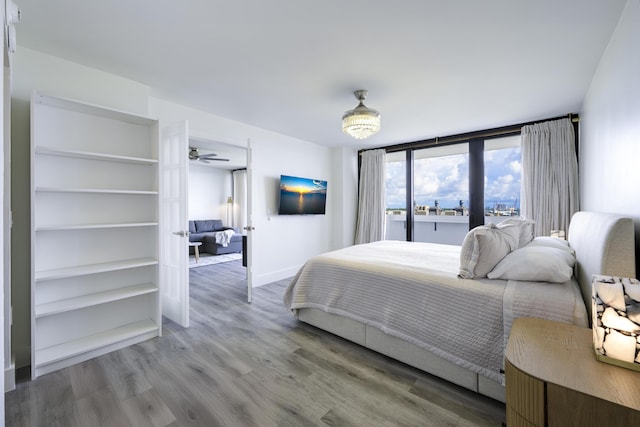 5600 N Flagler Dr Unit 1207, West Palm Beach, FL 33407 - bedroom with wood finished floors and baseboards
