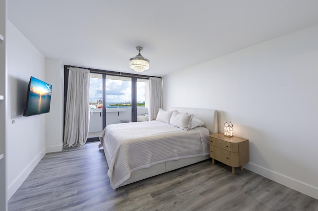 5600 N Flagler Dr Unit 1207, West Palm Beach, FL 33407 - bedroom featuring wood finished floors and baseboards