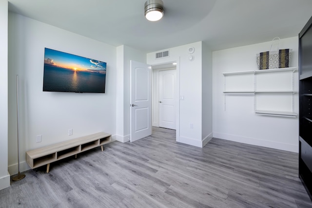 5600 N Flagler Dr Unit 1207, West Palm Beach, FL 33407 - unfurnished bedroom with wood finished floors, visible vents, and baseboards