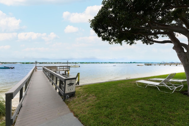 5600 N Flagler Dr Unit 1207, West Palm Beach, FL 33407 - dock area with a water view and a lawn