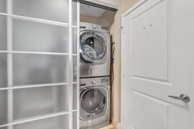 300 S Australian Ave Unit 409, West Palm Beach, FL 33401 - laundry area featuring laundry area and stacked washer / dryer