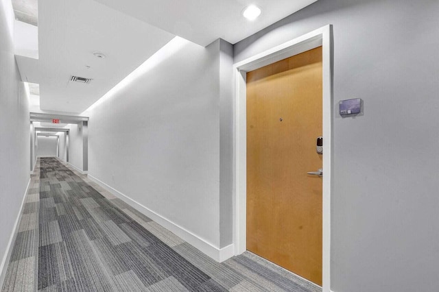 300 S Australian Ave Unit 409, West Palm Beach, FL 33401 - hall with visible vents, carpet, and baseboards
