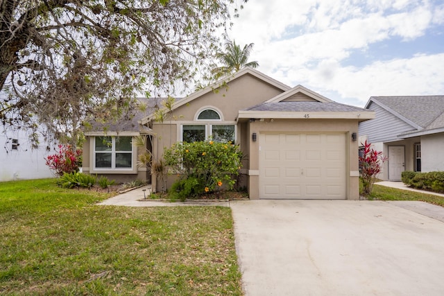 45 Misty Meadow Dr, Boynton Beach, FL 33436 - single story home with a front lawn, stucco siding, driveway, and an attached garage