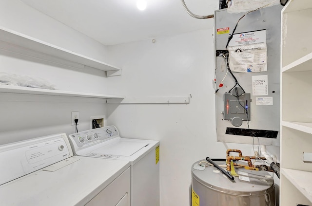 laundry area with water heater, laundry area, and washer and dryer