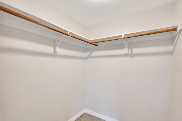 walk in closet featuring light tile patterned floors