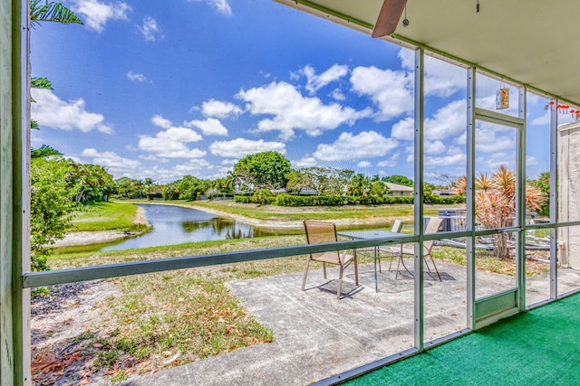 surrounding community featuring a patio and a water view