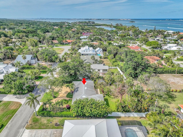 birds eye view of property featuring a water view and a residential view