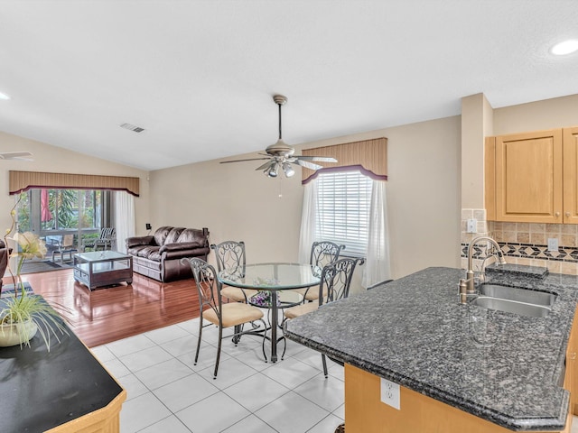 dining space with plenty of natural light, light tile patterned floors, ceiling fan, and visible vents