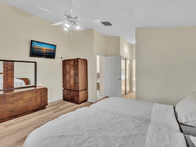 bedroom with baseboards, ceiling fan, wood finished floors, and visible vents
