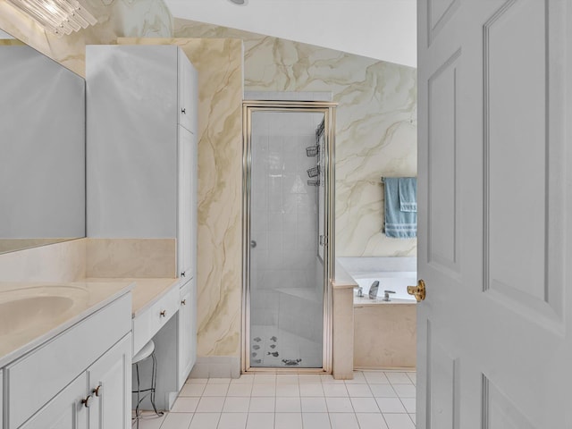 full bathroom featuring vanity, tile patterned floors, a garden tub, and a stall shower