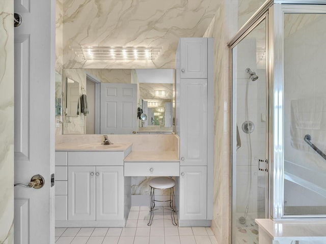 full bathroom with vanity, tile patterned floors, and a stall shower
