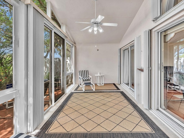 unfurnished sunroom with vaulted ceiling