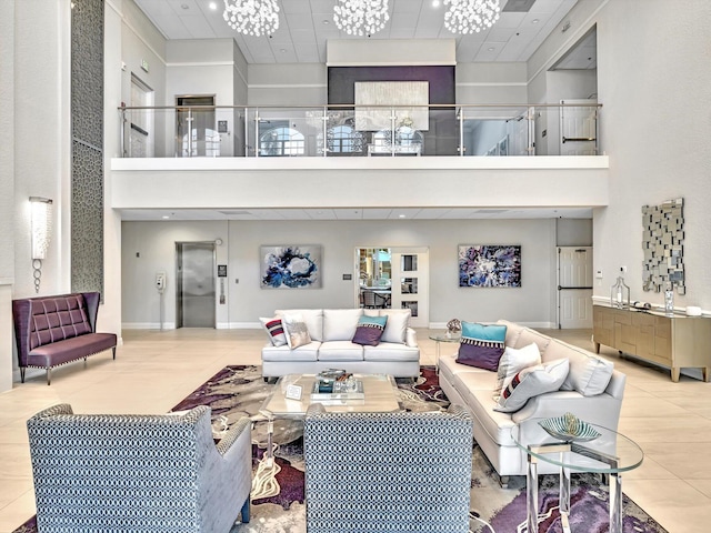 living room featuring tile patterned flooring, a paneled ceiling, a towering ceiling, and an inviting chandelier