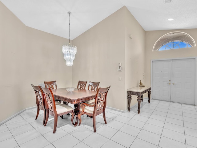 dining room with baseboards and a chandelier