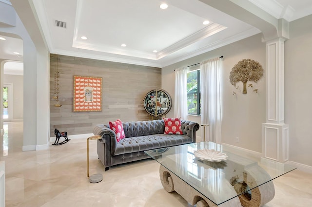 living area featuring recessed lighting, arched walkways, ornate columns, an accent wall, and visible vents