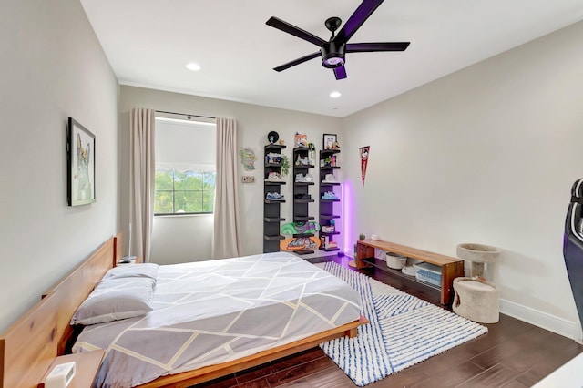 bedroom featuring baseboards, recessed lighting, wood finished floors, and a ceiling fan