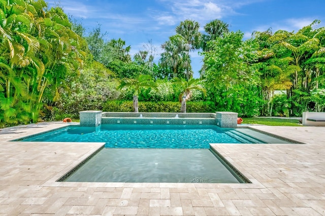 pool featuring a patio area