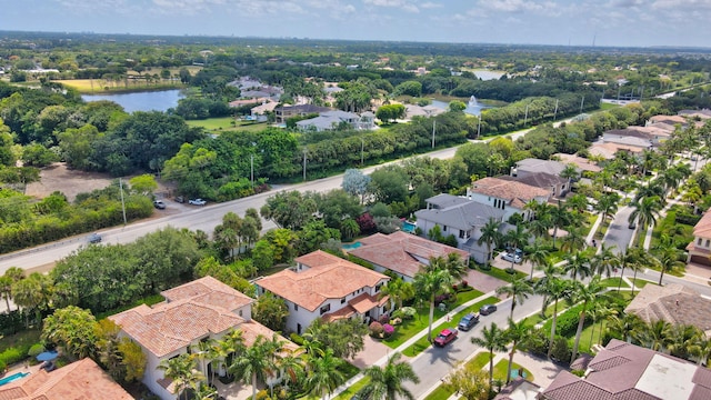 bird's eye view with a residential view and a water view