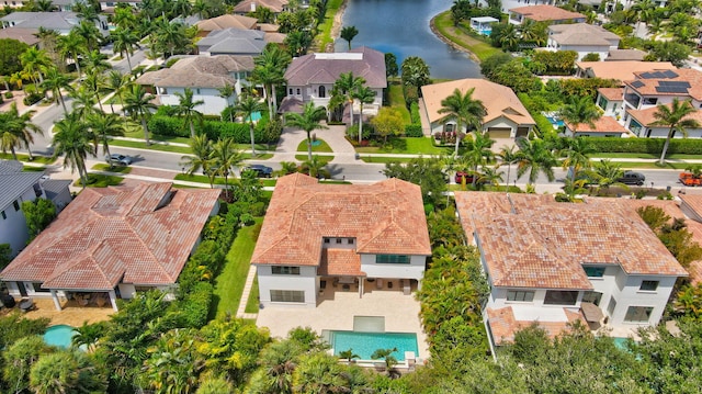 birds eye view of property featuring a water view and a residential view