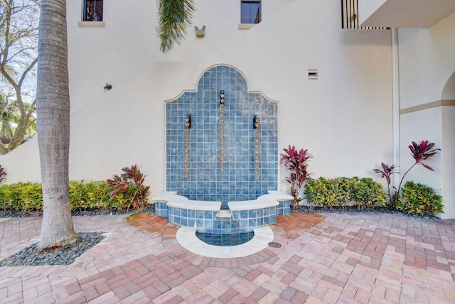 view of exterior entry featuring stucco siding
