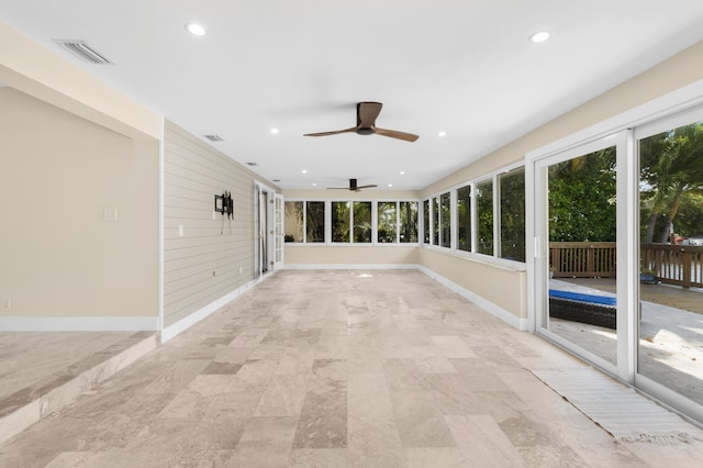 unfurnished sunroom featuring visible vents, recessed lighting, and baseboards