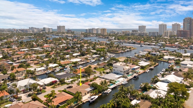 drone / aerial view with a view of city, a residential view, and a water view