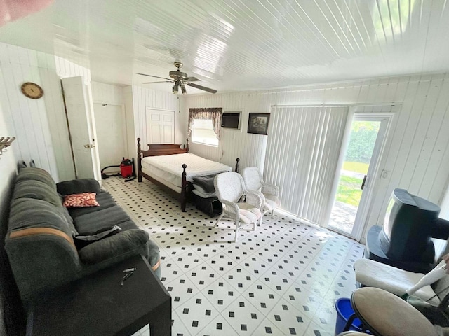 3020 SE 38th Ave, Okeechobee, FL 34974 - bedroom featuring wooden walls, access to exterior, and multiple windows