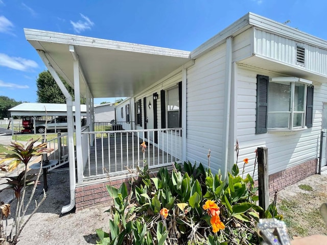 3020 SE 38th Ave, Okeechobee, FL 34974 - view of home's exterior featuring covered porch