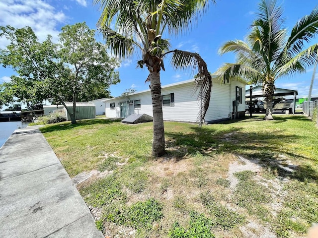 3020 SE 38th Ave, Okeechobee, FL 34974 - view of home's exterior featuring a yard