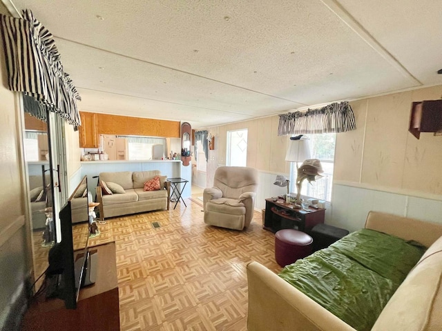 3020 SE 38th Ave, Okeechobee, FL 34974 - living room with wooden walls and a textured ceiling